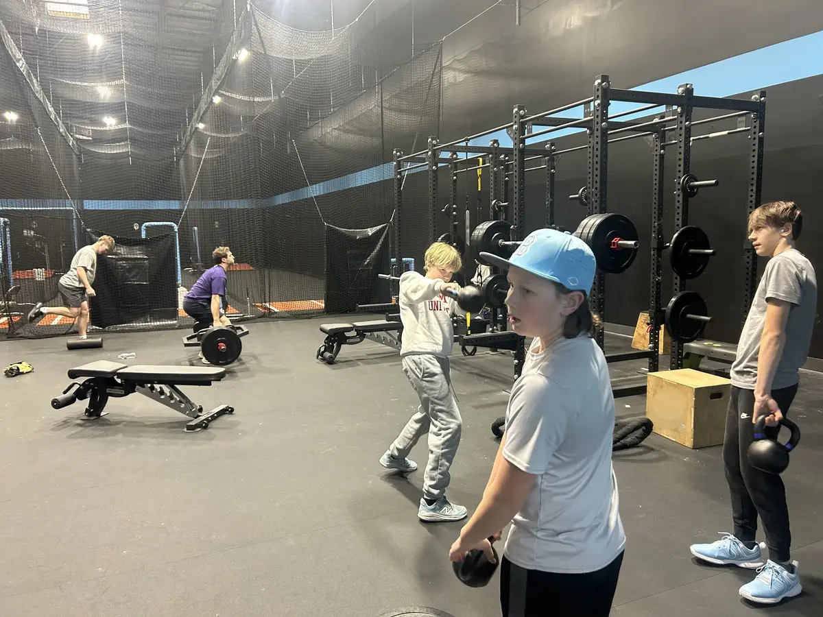 Trosky Bears players training in the weight room